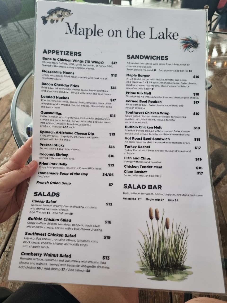 Menu page showing wings, nachos, and salads.